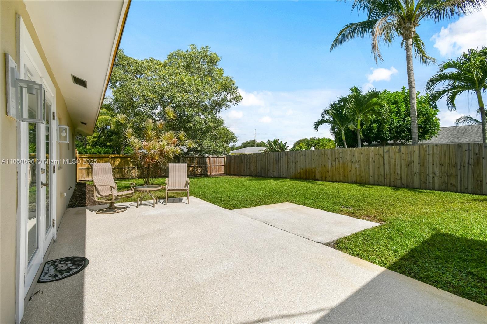 110 Windsor Road East Jupiter, FL 33469 - Photo 26 of 30 a view of backyard with outdoor seating and green space