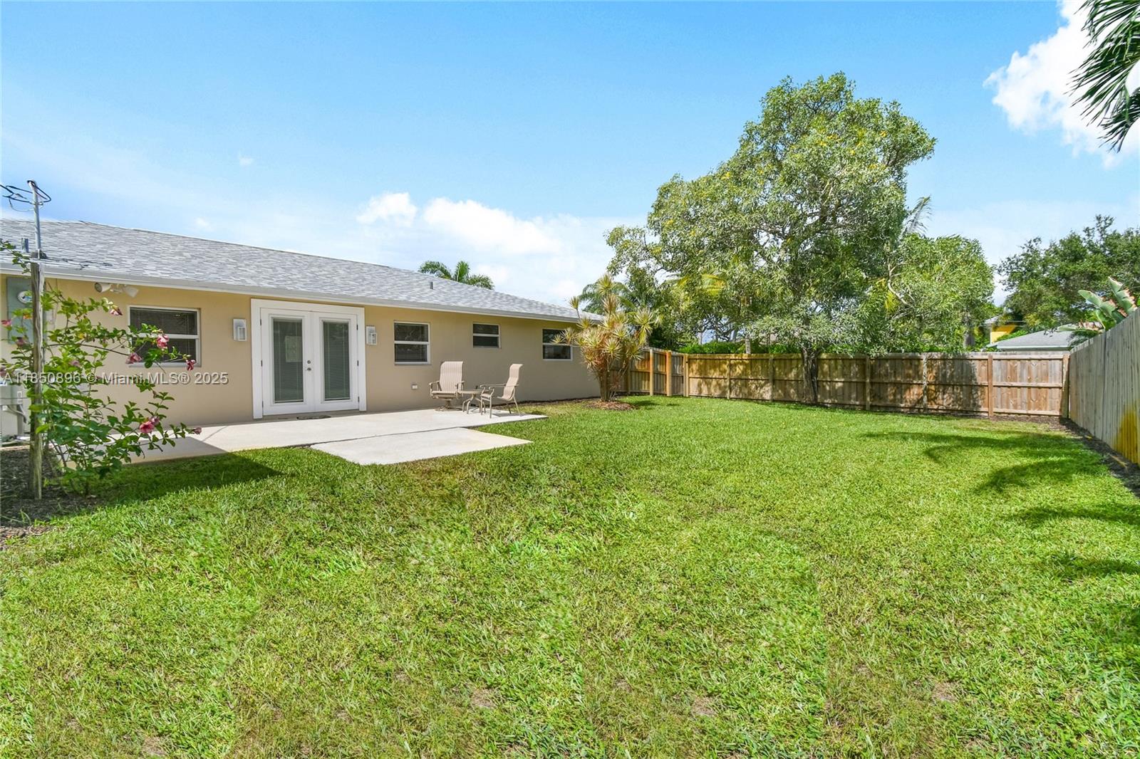 110 Windsor Road East Jupiter, FL 33469 - Photo 29 of 30 a view of house with backyard