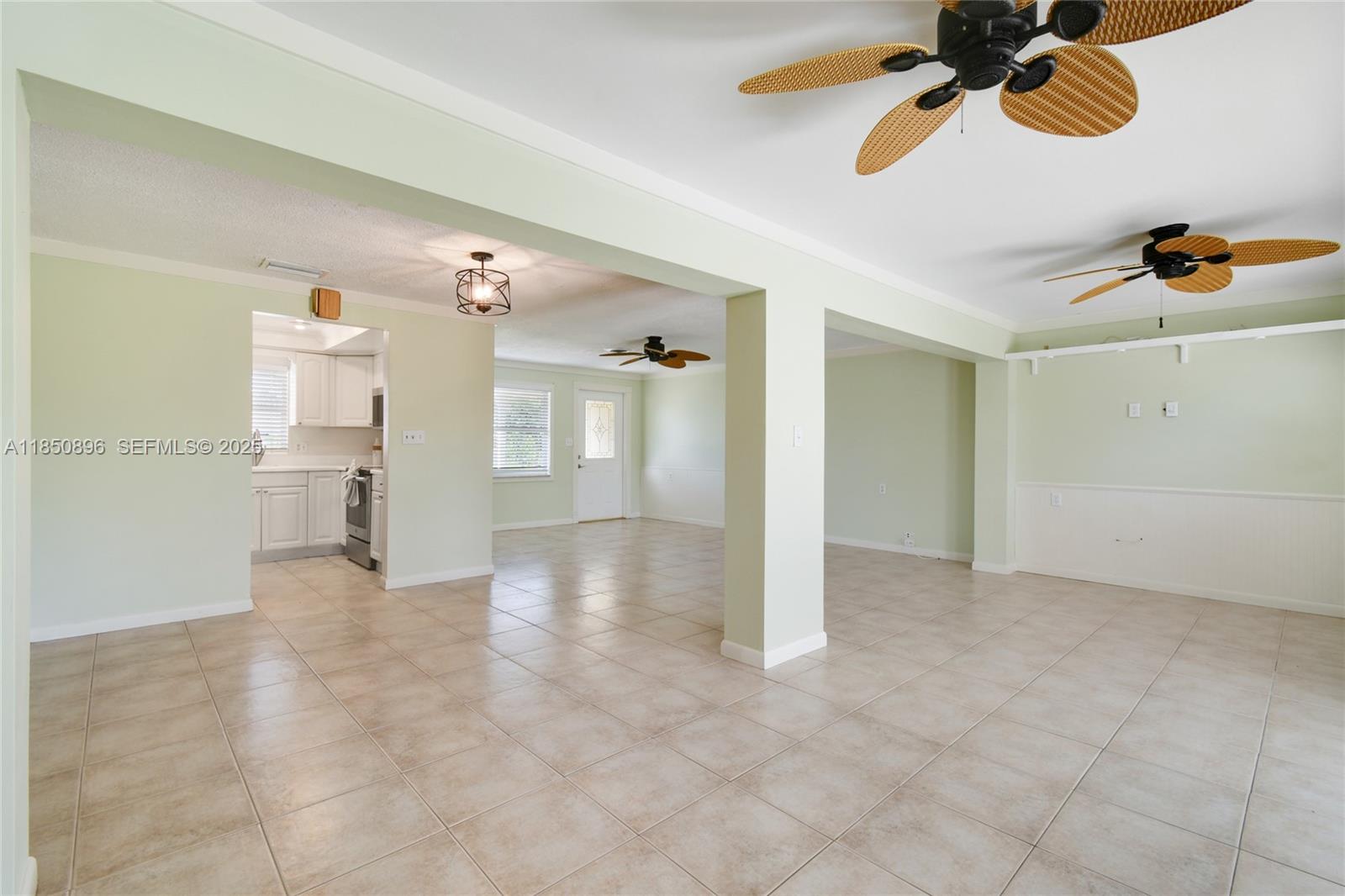 110 Windsor Road East Jupiter, FL 33469 - Photo 9 of 30 a view of a chandelier fan and entryway