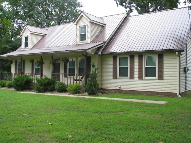 408 Murrell Road Dickson, TN 37055 - Photo 1 of 19 This home has new roof, windows, corian counter tops and hardwood flooring.