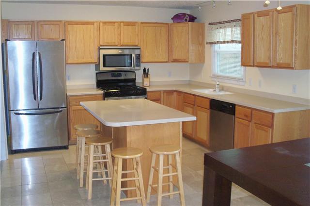 408 Murrell Road Dickson, TN 37055 - Photo 3 of 19 Kitchen has Corian counter tops, tile floor, island and ALL appliances stay!!!