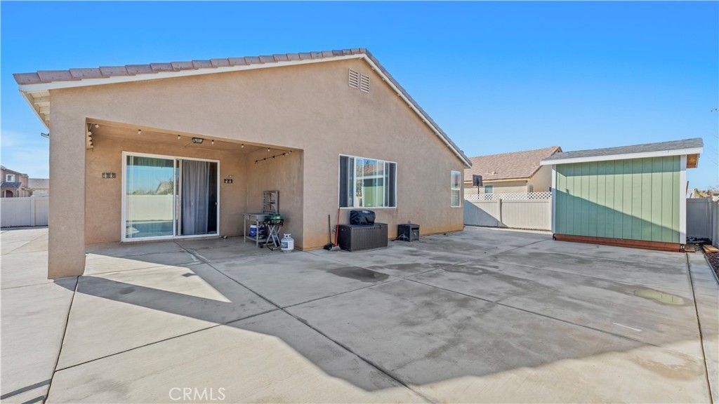 11780 Poppy Road Adelanto, CA 92301 - Photo 27 of 35 a view of a house with a backyard