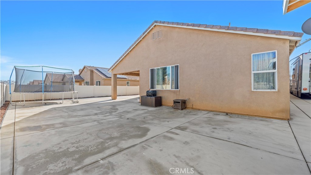 11780 Poppy Road Adelanto, CA 92301 - Photo 28 of 35 a view of a house with backyard