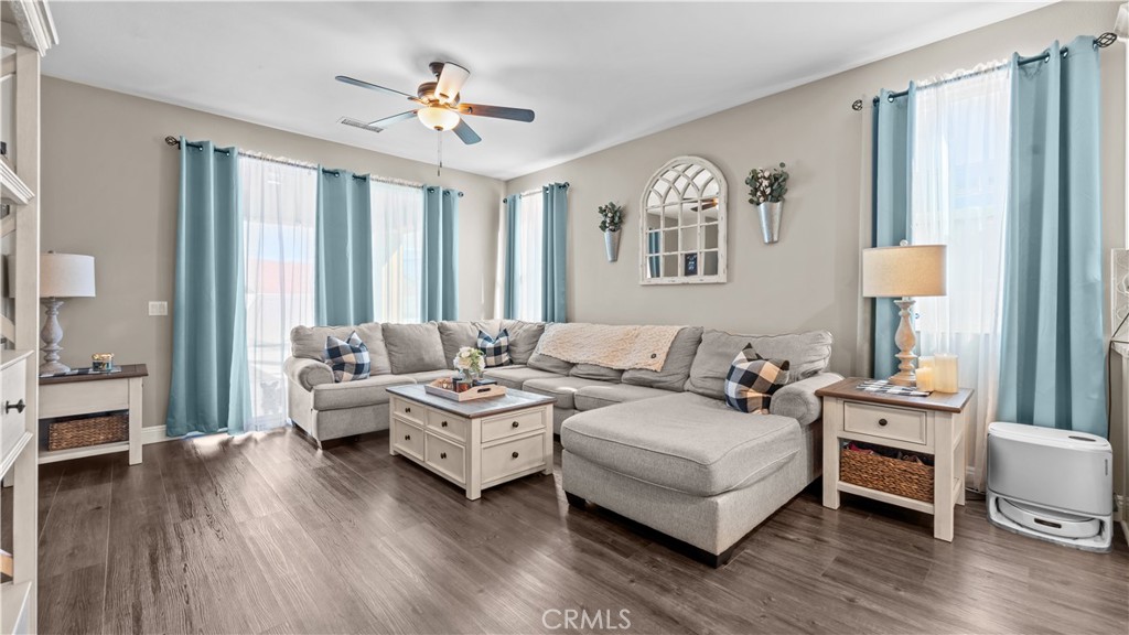 11780 Poppy Road Adelanto, CA 92301 - Photo 6 of 35 a living room with furniture and wooden floor