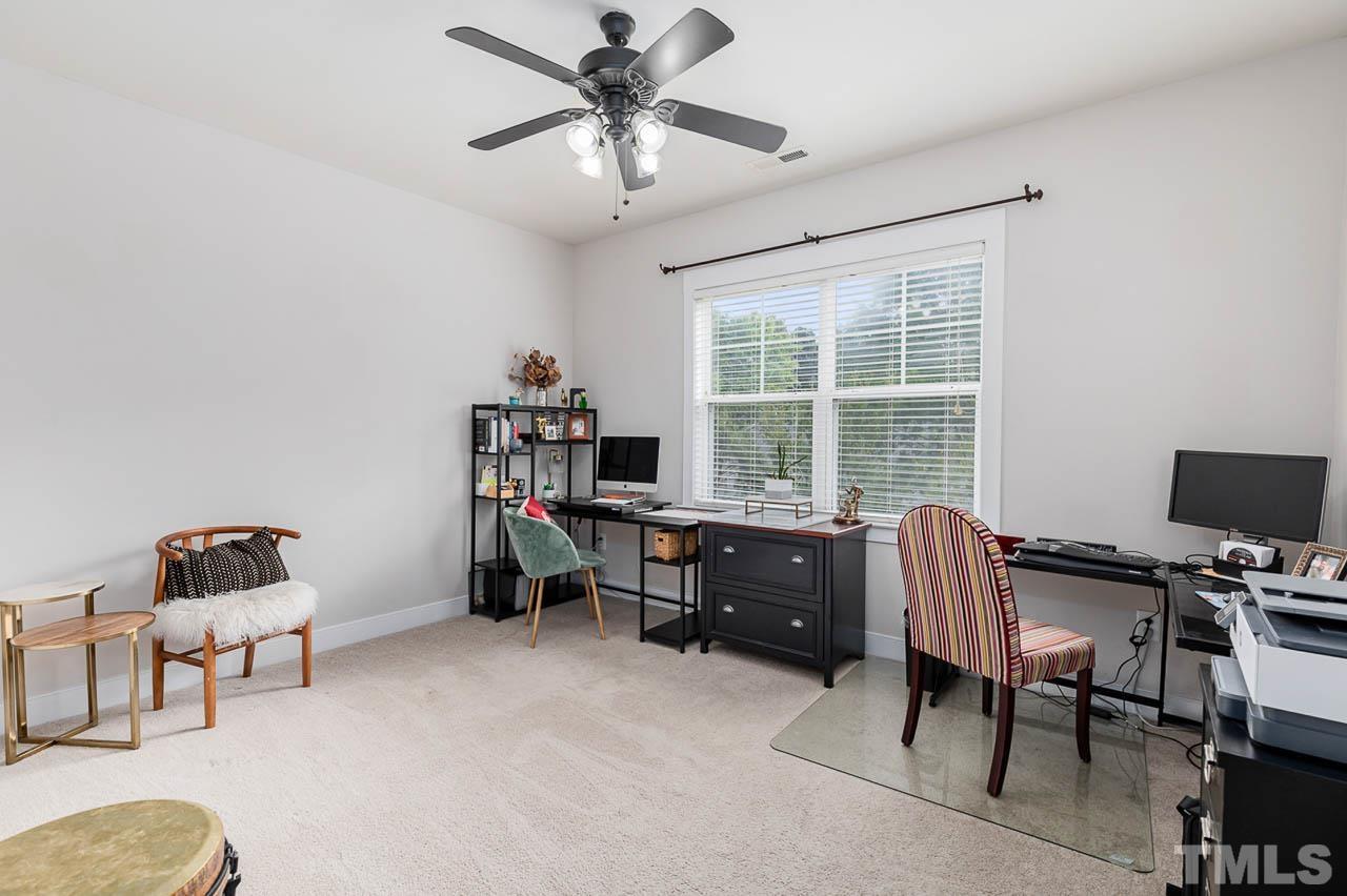 2813 Falls River Avenue Raleigh, NC 27614 - Photo 15 of 28 a view of a workspace with furniture and a window