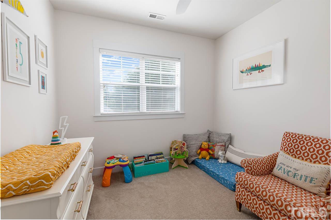 2813 Falls River Avenue Raleigh, NC 27614 - Photo 17 of 28 a bedroom with furniture and a window