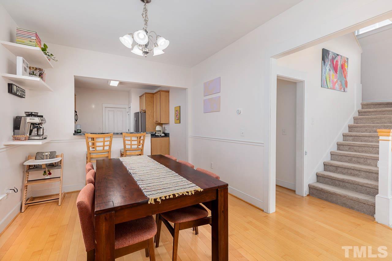 2813 Falls River Avenue Raleigh, NC 27614 - Photo 6 of 28 a view of a dining room with furniture and wooden floor