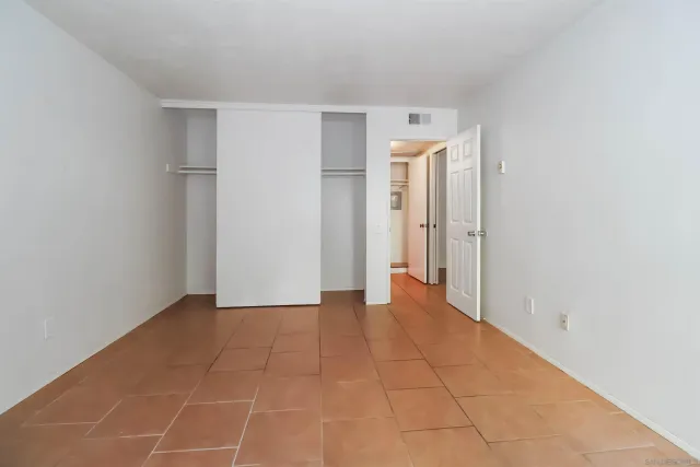 a bathroom with a toilet a sink and shower
