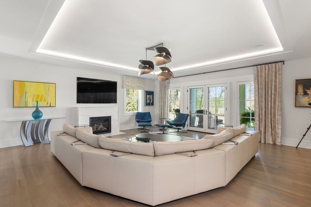 151 Forest Street Sherborn, MA 01770 - Photo 15 of 41 a living room with fireplace furniture and a flat screen tv