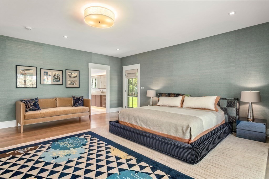 151 Forest Street Sherborn, MA 01770 - Photo 18 of 41 a bedroom with a bed and a couch