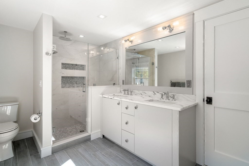 151 Forest Street Sherborn, MA 01770 - Photo 22 of 41 a bathroom with a sink a toilet and shower