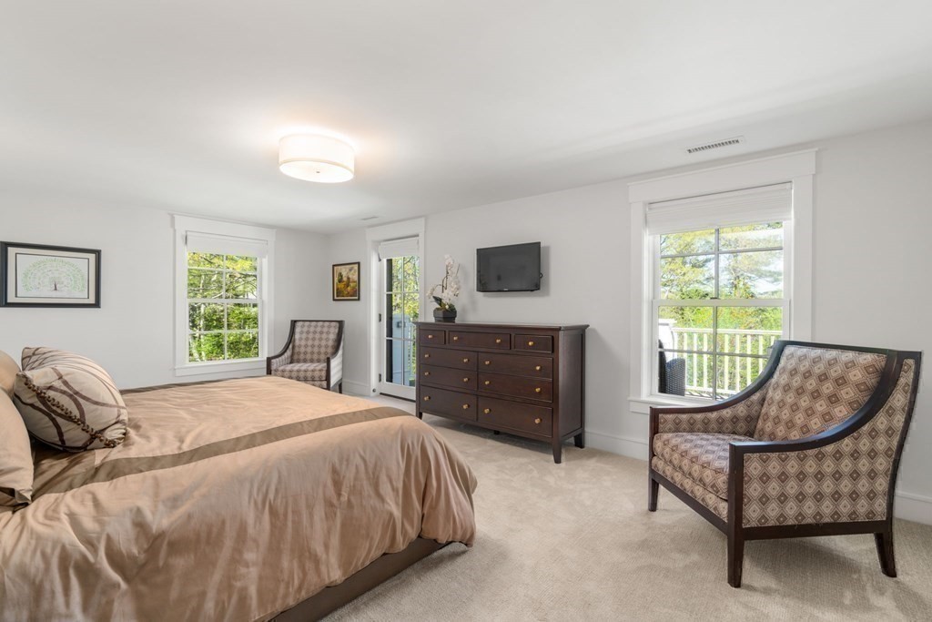 151 Forest Street Sherborn, MA 01770 - Photo 23 of 41 a bedroom with a bed and a couch