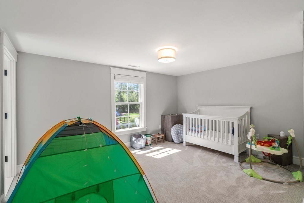 151 Forest Street Sherborn, MA 01770 - Photo 26 of 41 a bedroom with a bed and a window