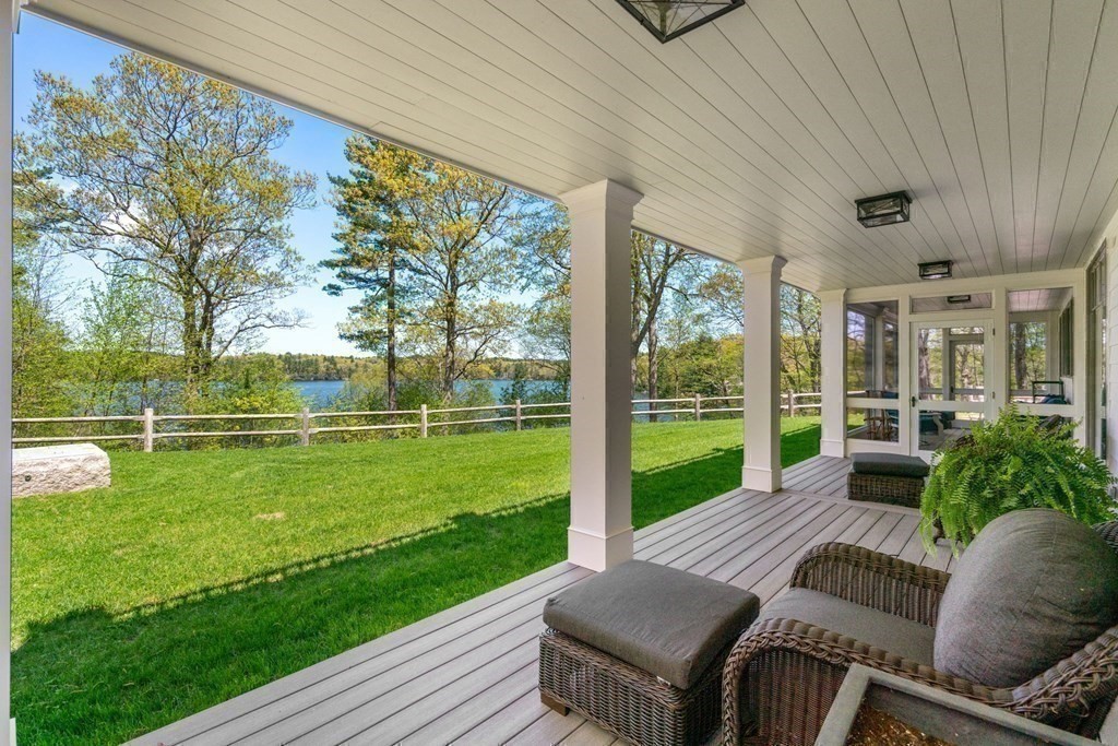 151 Forest Street Sherborn, MA 01770 - Photo 31 of 41 a view of a patio with couches chairs and a big yard