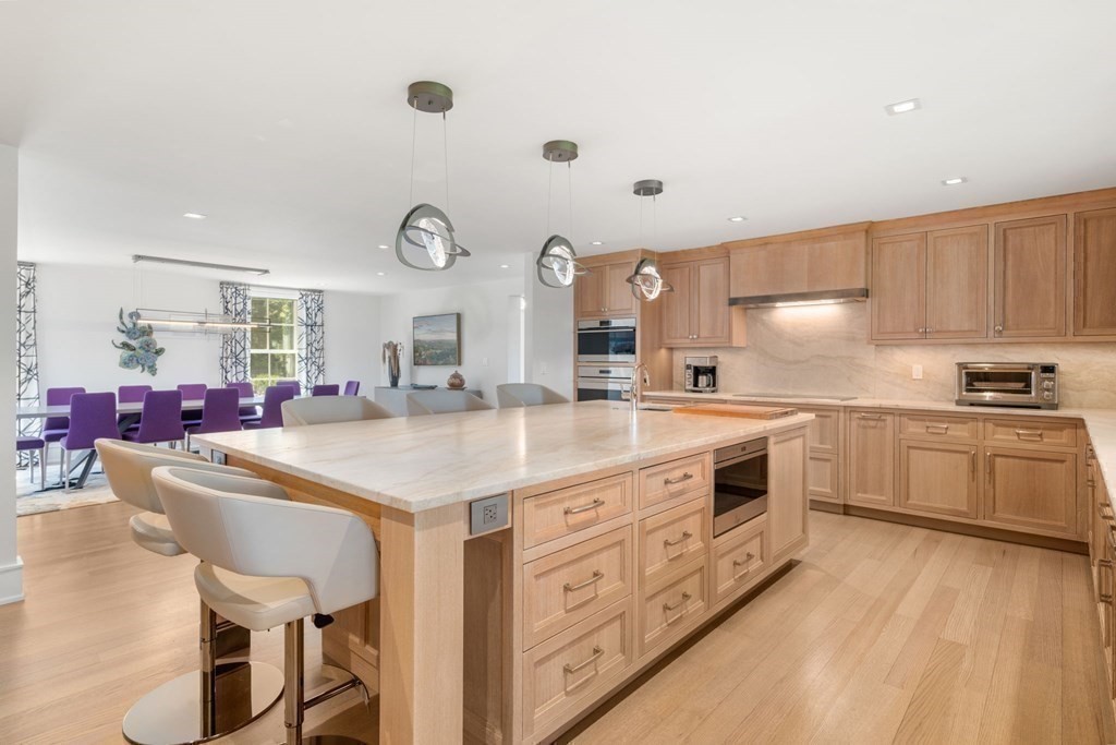 151 Forest Street Sherborn, MA 01770 - Photo 8 of 41 a kitchen with granite countertop a sink cabinets and stainless steel appliances