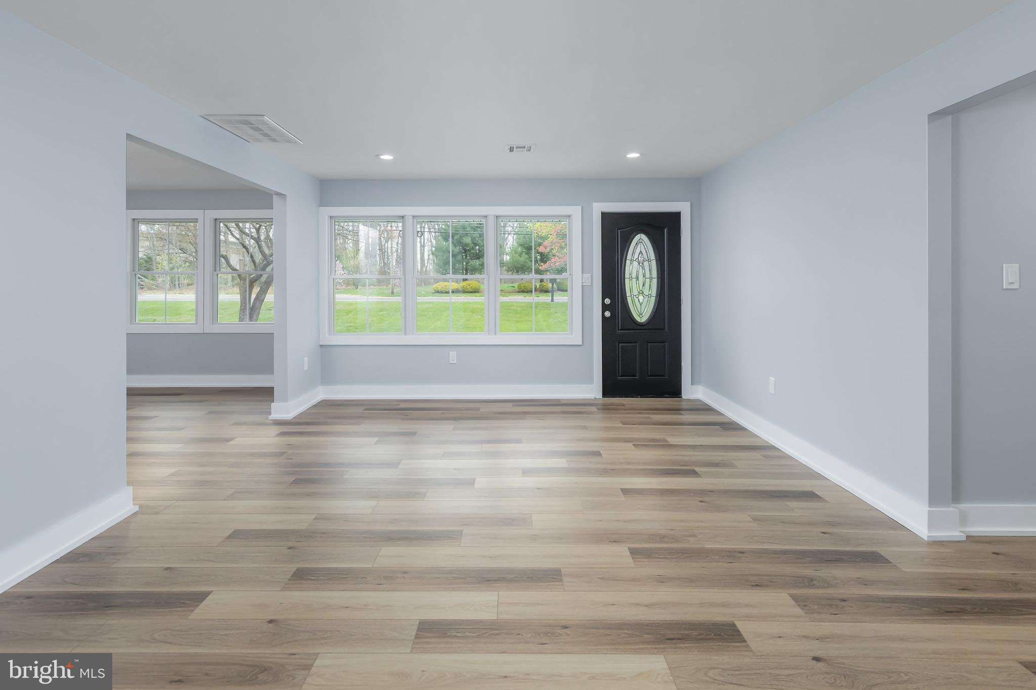 370 Ganttown Road Sewell, NJ 08080 - Photo 17 of 46 a view of an empty room with wooden floor and a window