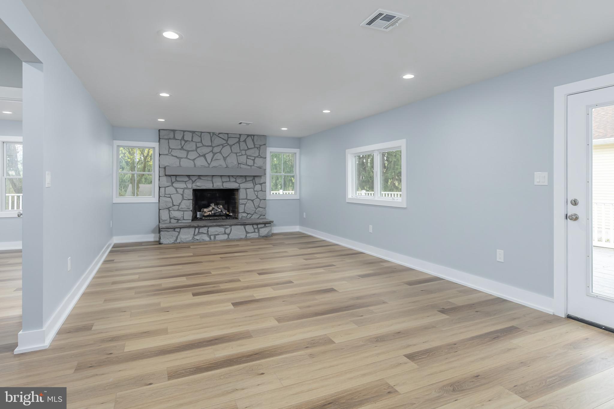 370 Ganttown Road Sewell, NJ 08080 - Photo 19 of 46 an empty room with wooden floor fireplace and window