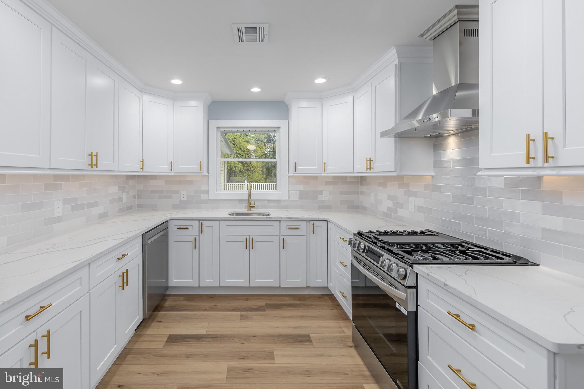 370 Ganttown Road Sewell, NJ 08080 - Photo 23 of 46 a kitchen with granite countertop a sink stove and cabinets