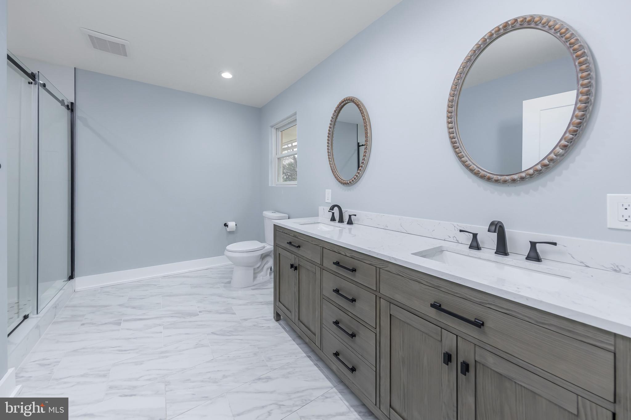 370 Ganttown Road Sewell, NJ 08080 - Photo 26 of 46 a bathroom with a double vanity sink double and a mirror