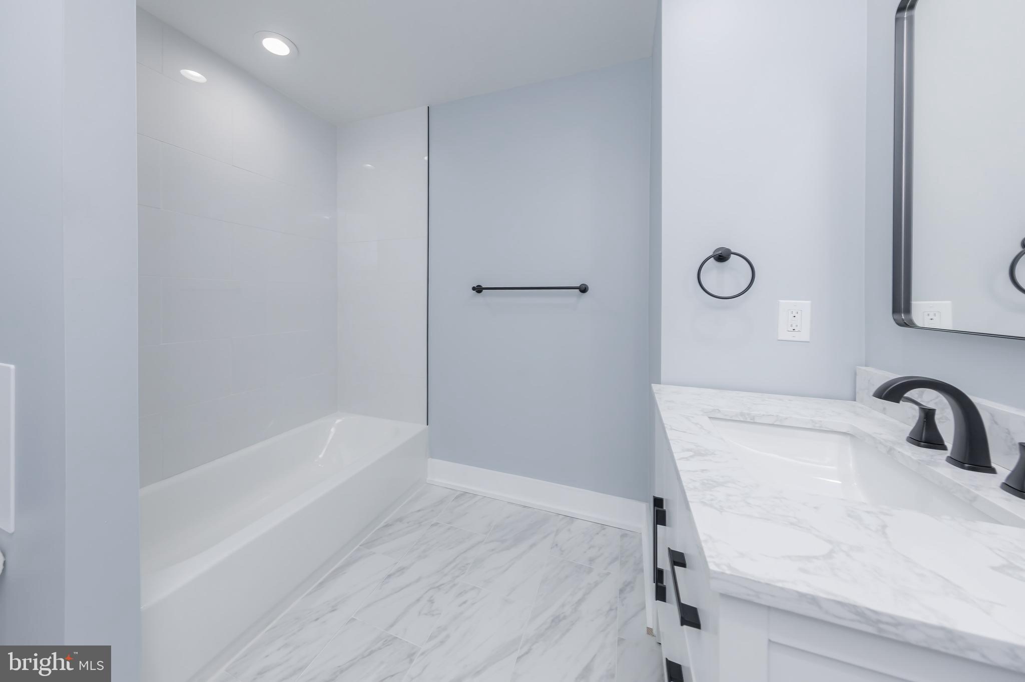 370 Ganttown Road Sewell, NJ 08080 - Photo 29 of 46 a bathroom with a sink and a bathtub
