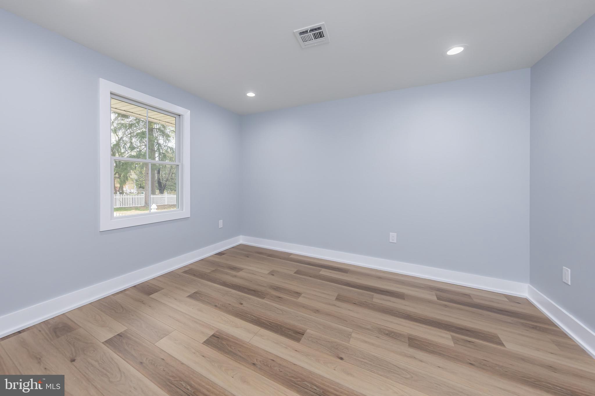 370 Ganttown Road Sewell, NJ 08080 - Photo 31 of 46 wooden floor in an empty room with a window