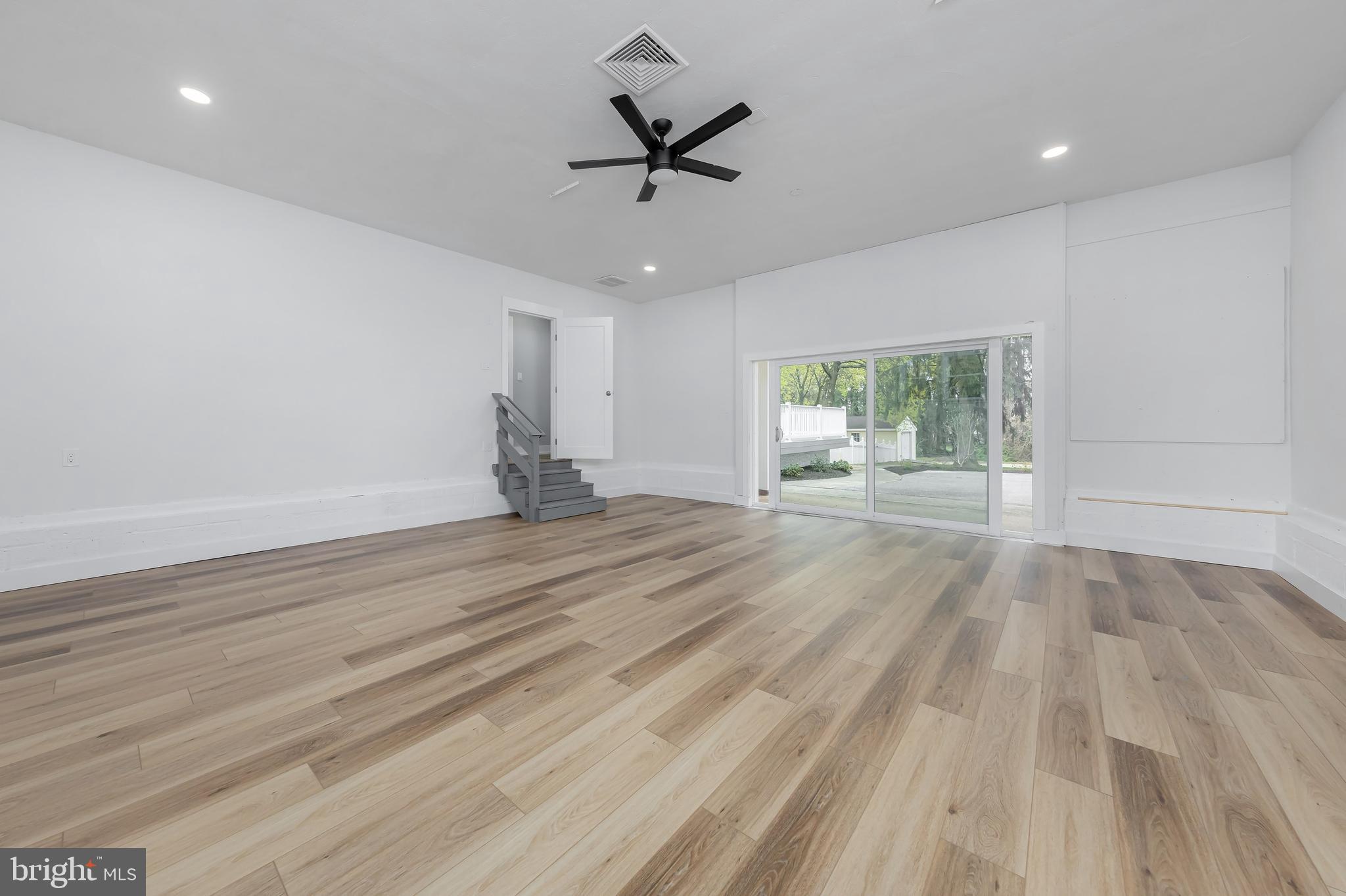 370 Ganttown Road Sewell, NJ 08080 - Photo 32 of 46 an empty room with wooden floor and ceiling fan