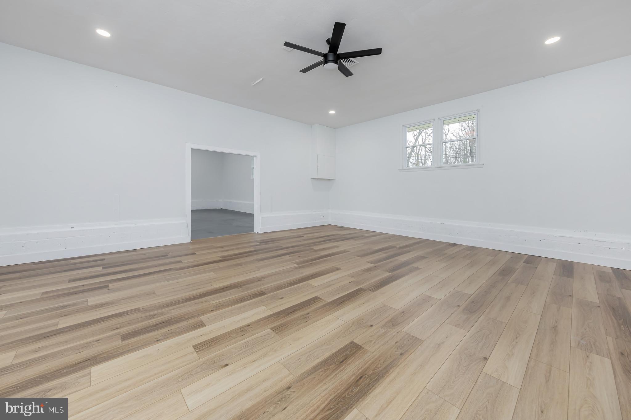 370 Ganttown Road Sewell, NJ 08080 - Photo 33 of 46 an empty room with wooden floor and windows