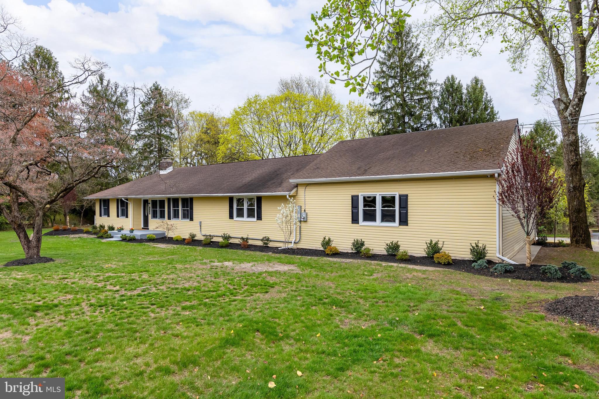 370 Ganttown Road Sewell, NJ 08080 - Photo 4 of 46 a front view of a house with a garden