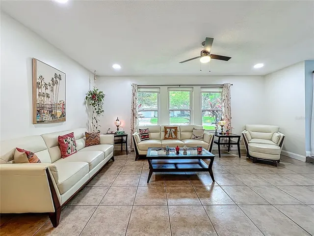 a view of a dining room with furniture wooden floor and chandelier