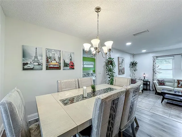 a kitchen with stainless steel appliances granite countertop lots of counter top space and wooden floor