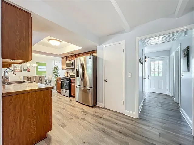 a bedroom that has a bed and a table in it