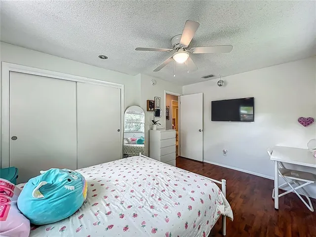 a reading room with furniture and a flat screen tv