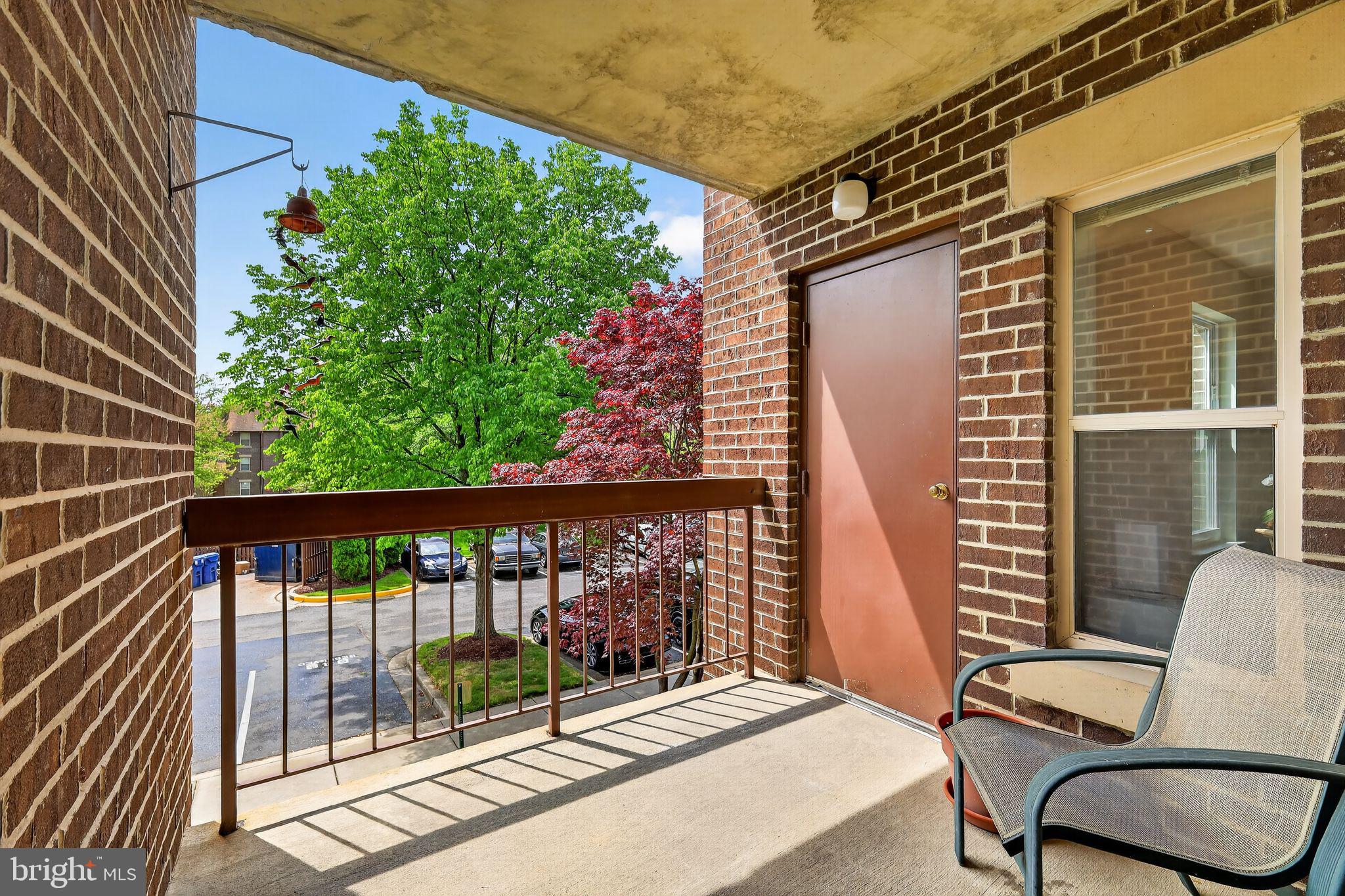 7804 Guildberry Court, Unit 202 Gaithersburg, MD 20879 - Photo 17 of 19 a view of a two chairs in the balcony