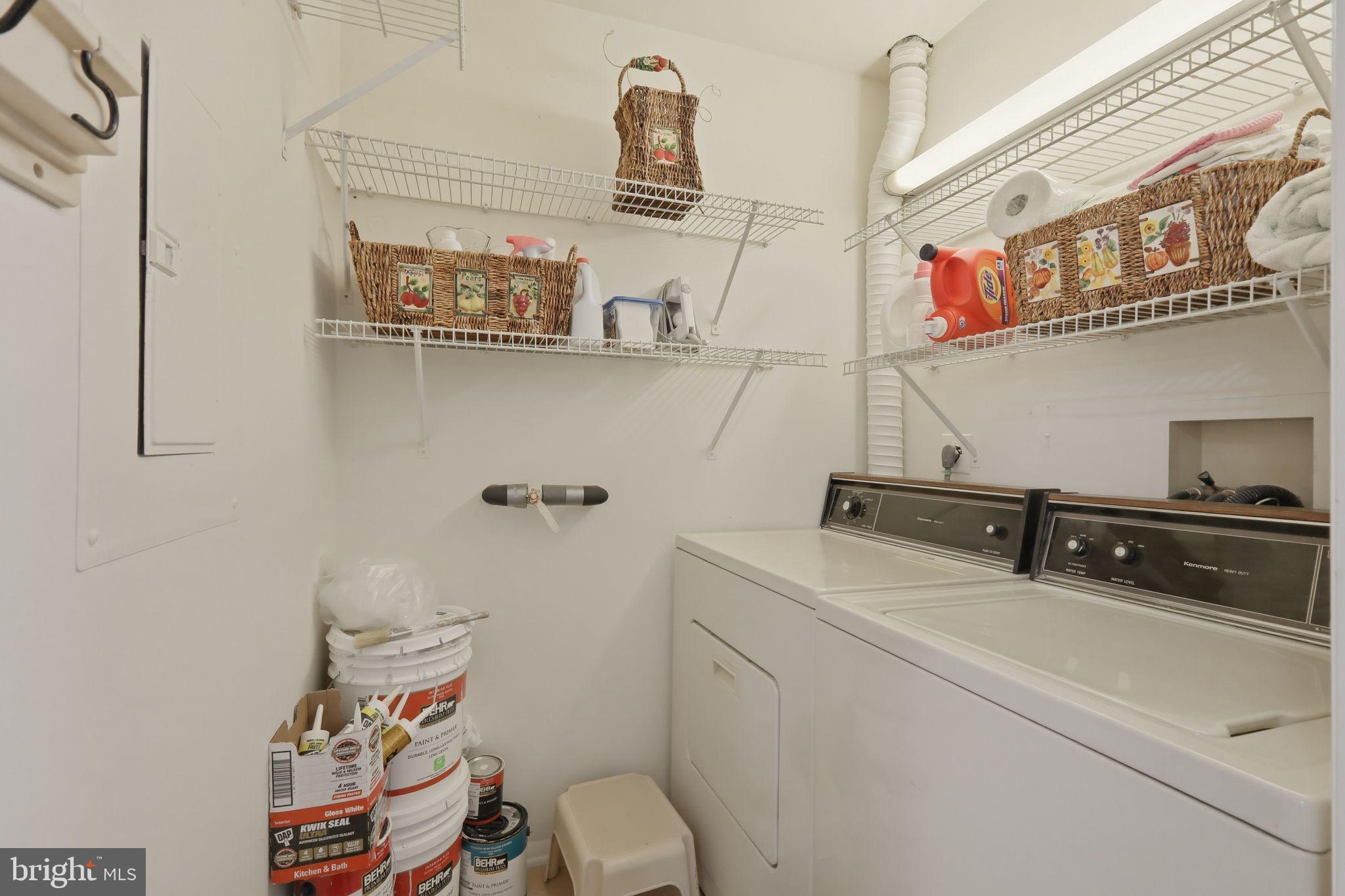 7804 Guildberry Court, Unit 202 Gaithersburg, MD 20879 - Photo 19 of 19 a bathroom with a sink a toilet and mirror