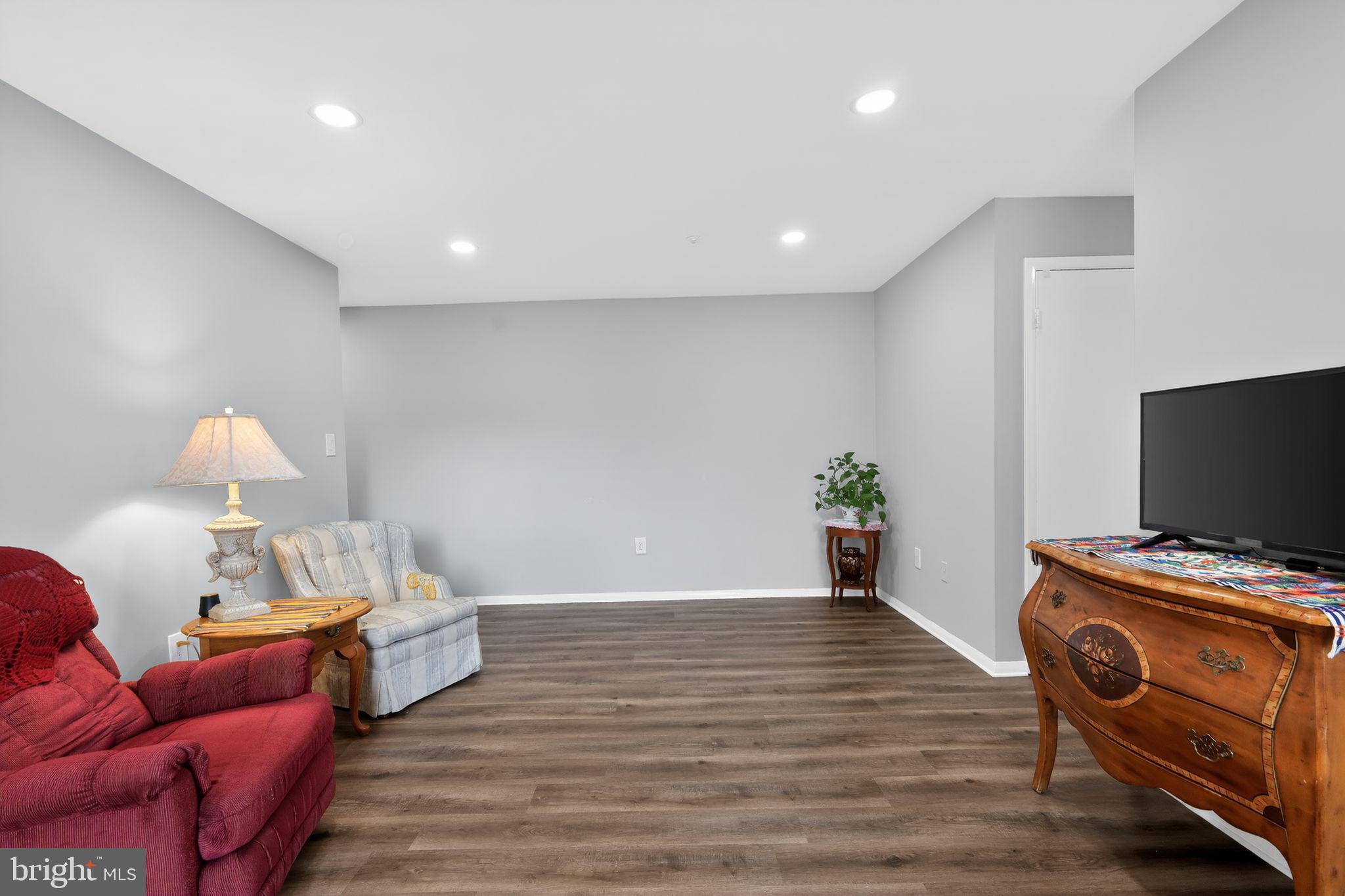 7804 Guildberry Court, Unit 202 Gaithersburg, MD 20879 - Photo 6 of 19 a view of a livingroom with furniture and a couch