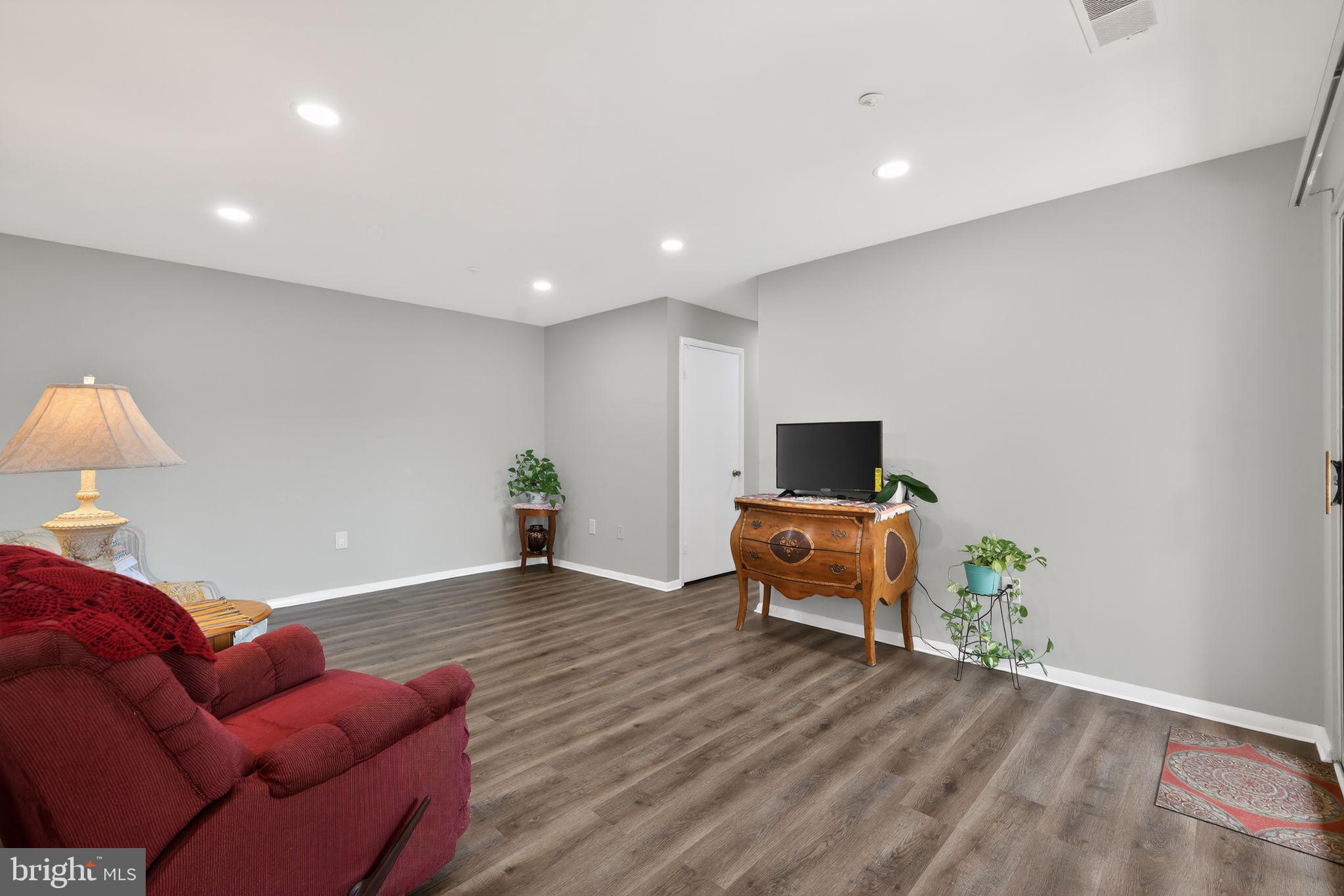 7804 Guildberry Court, Unit 202 Gaithersburg, MD 20879 - Photo 7 of 19 a living room with furniture
