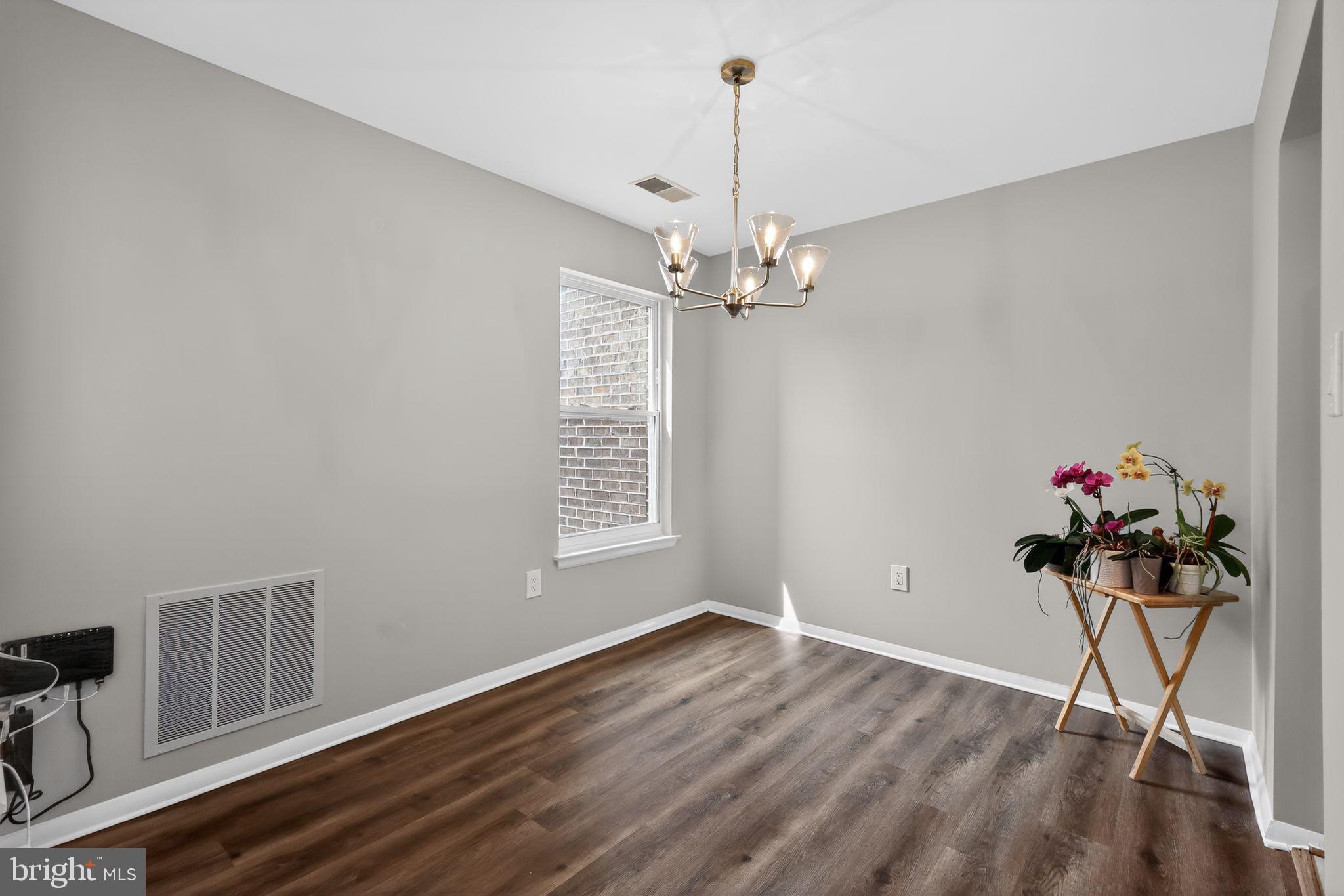 7804 Guildberry Court, Unit 202 Gaithersburg, MD 20879 - Photo 8 of 19 a view of a room with wooden floor gym equipment and a window