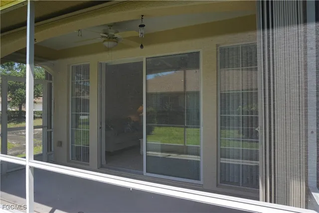 a view of street with houses and trees in the background