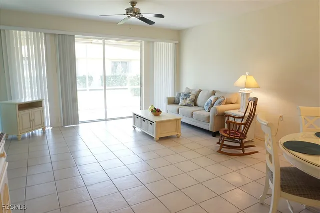 a kitchen with a sink and white cabinets