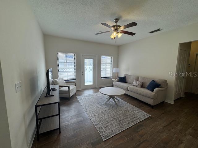 906 Pawstand Road Celebration, FL 34747 - Photo 17 of 29 a living room with furniture and a chandelier