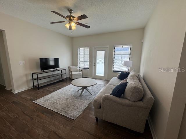 906 Pawstand Road Celebration, FL 34747 - Photo 18 of 29 a living room with furniture and a flat screen tv