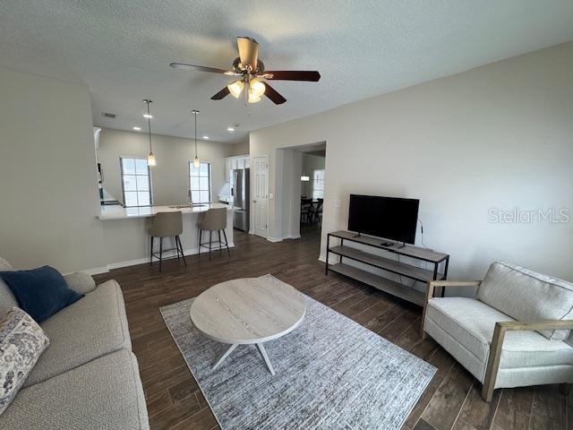 906 Pawstand Road Celebration, FL 34747 - Photo 19 of 29 a living room with furniture and a flat screen tv