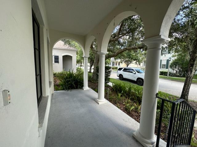 906 Pawstand Road Celebration, FL 34747 - Photo 2 of 29 a front view of a house with garden