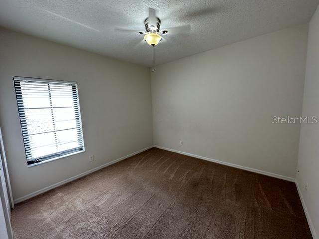 906 Pawstand Road Celebration, FL 34747 - Photo 21 of 29 an empty room with a window