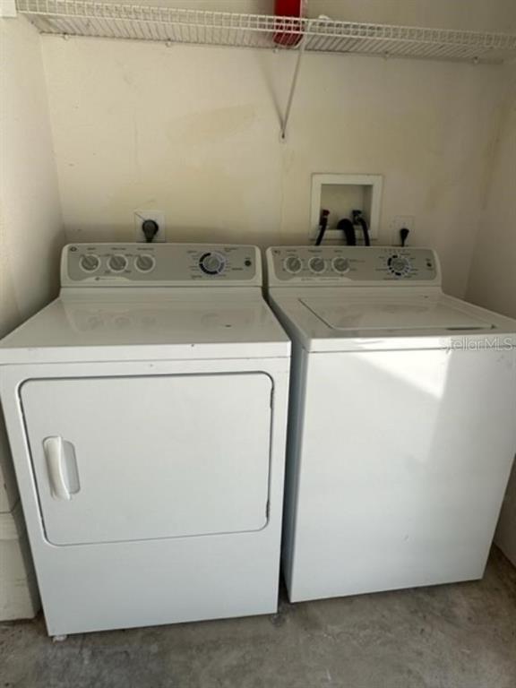 906 Pawstand Road Celebration, FL 34747 - Photo 24 of 29 a utility room with dryer and washer