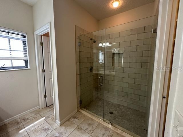 906 Pawstand Road Celebration, FL 34747 - Photo 7 of 29 a bathroom with a shower
