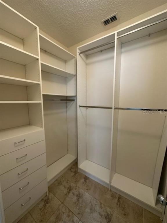 906 Pawstand Road Celebration, FL 34747 - Photo 10 of 29 a view of an empty walk in closet