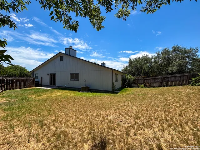 a house view with a backyard space