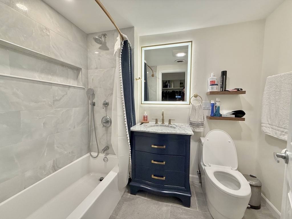 20 Stearns Road, Unit 45 Brookline, MA 02446 - Photo 11 of 22 a bathroom with a sink toilet and shower