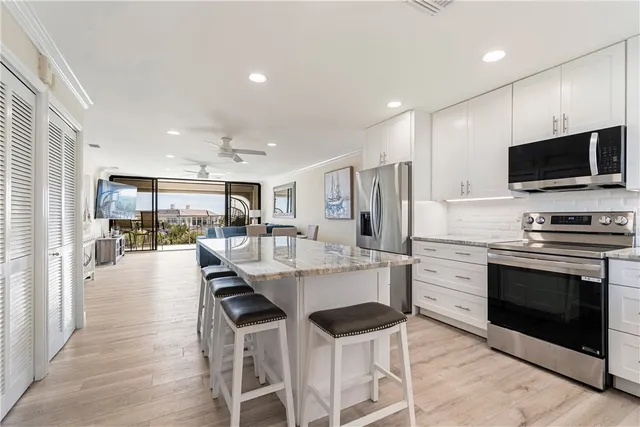 a living room with furniture wooden floor and a table